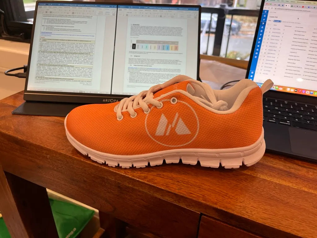 zero running shoes orange logo print